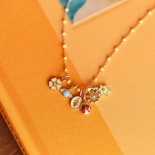 Pendentif Madone Or rose Résine rose bébé